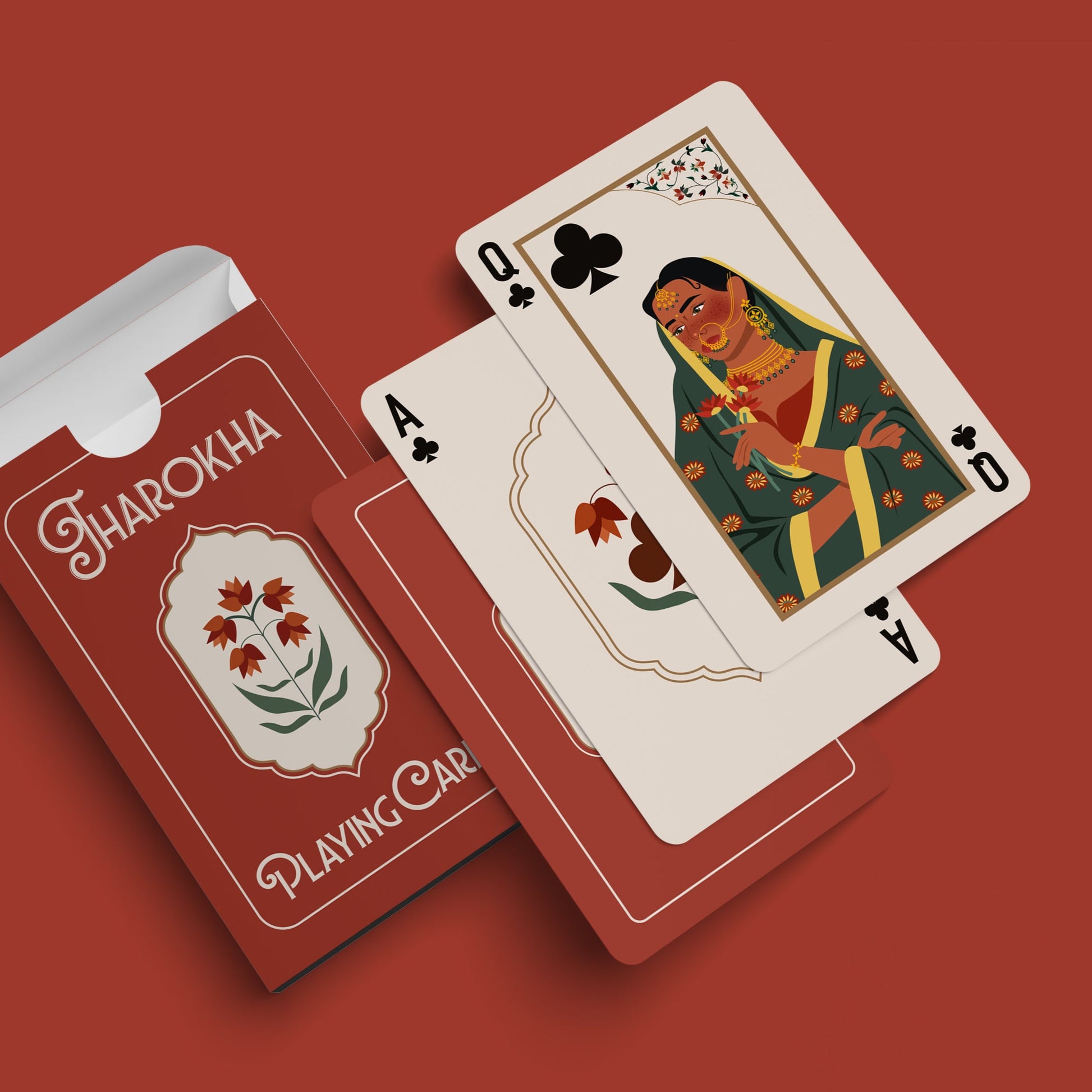 Playing cards with a red box labeled 'Jharokha' on a red background. A modern reimagining of a 1922 Indian deck, blending art, architecture, and history.