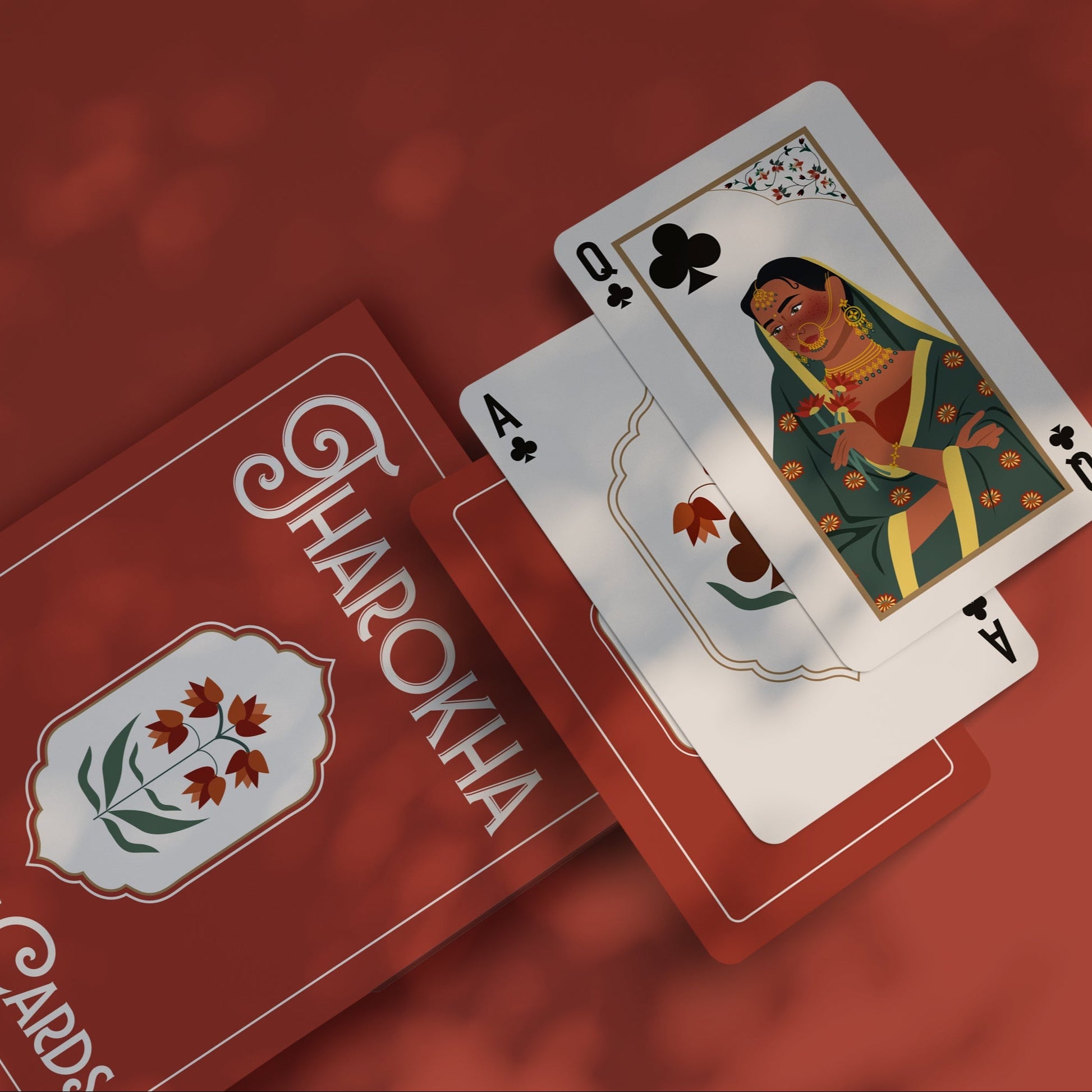 Playing cards with a red box labeled 'Jharokha' on a red background